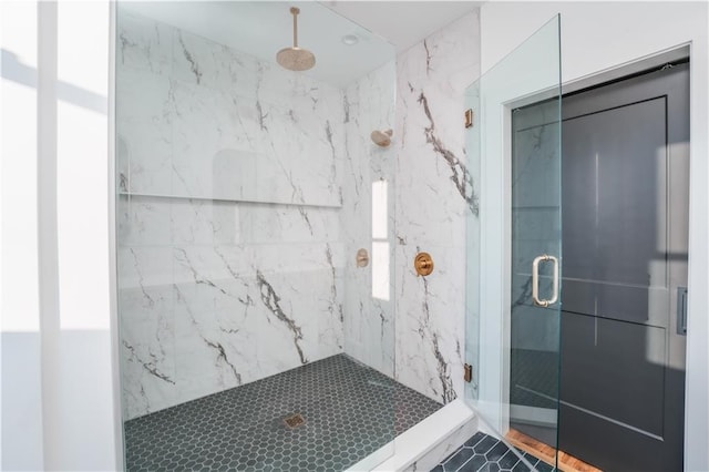 bathroom with a shower with shower door