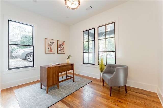 office with light hardwood / wood-style floors