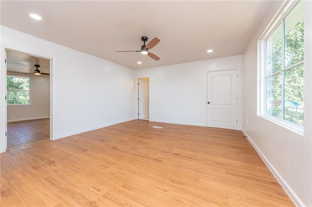 unfurnished room featuring baseboards, a ceiling fan, recessed lighting, and light wood finished floors