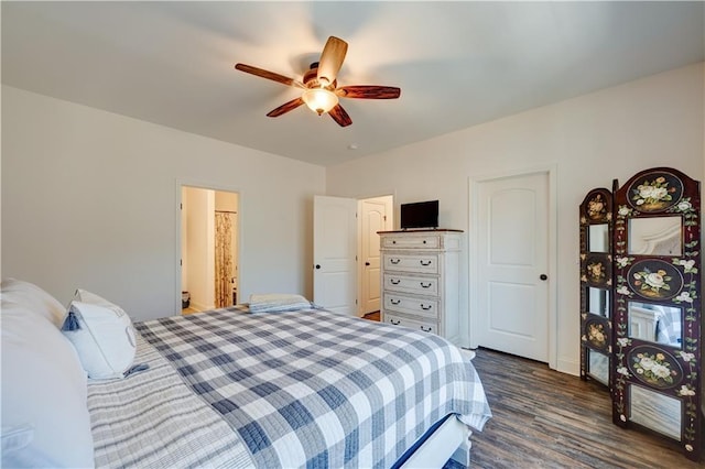 bedroom with a ceiling fan and dark wood finished floors