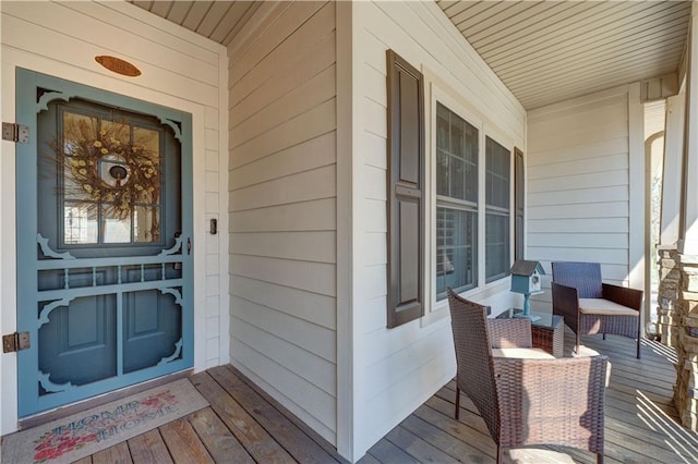 doorway to property featuring covered porch