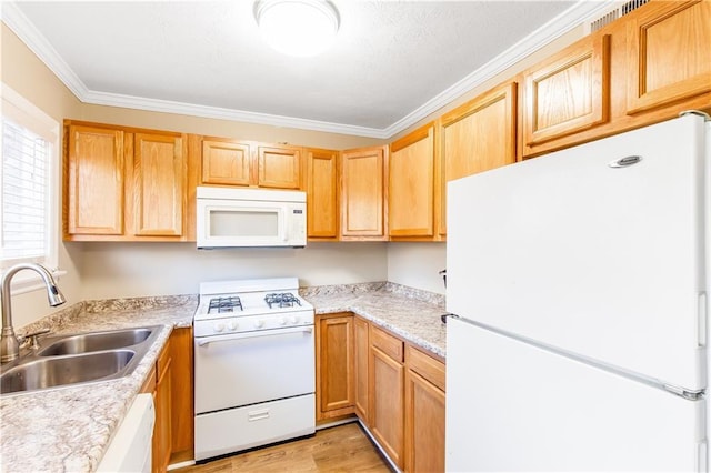 kitchen featuring white appliances, ornamental molding, sink, and light wood-type flooring