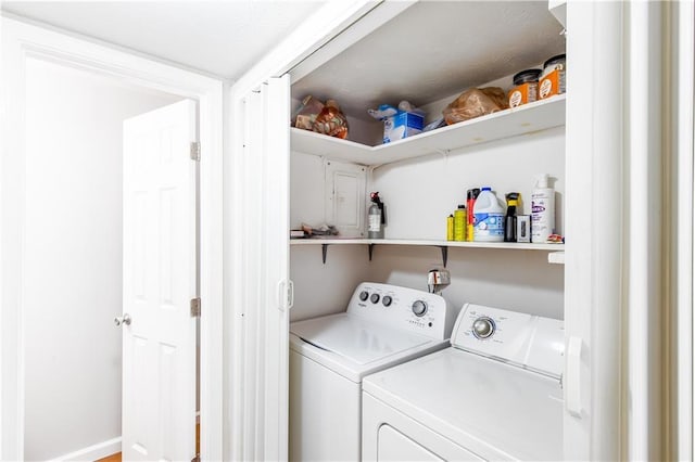 clothes washing area featuring separate washer and dryer