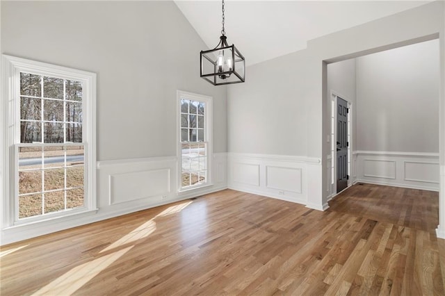 unfurnished dining area featuring hardwood / wood-style flooring and a healthy amount of sunlight