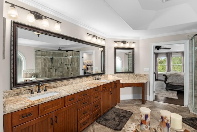 bathroom featuring walk in shower, ornamental molding, a raised ceiling, and vanity