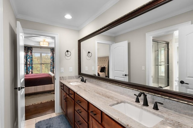 bathroom with tile patterned floors, vanity, and ornamental molding