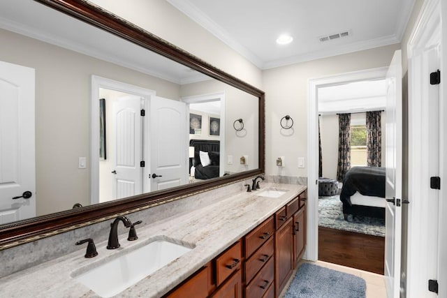 bathroom with vanity, tile patterned floors, and ornamental molding