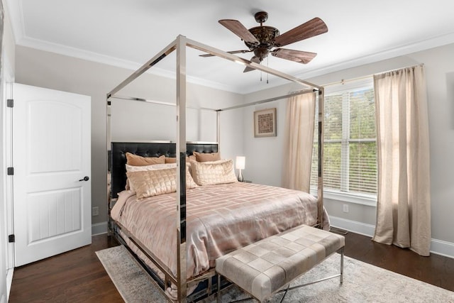 bedroom featuring ceiling fan, dark hardwood / wood-style floors, and multiple windows