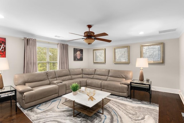 living room with ceiling fan, dark wood-type flooring, and crown molding