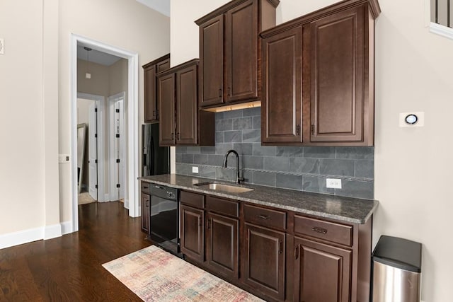 kitchen featuring black dishwasher, backsplash, dark hardwood / wood-style flooring, dark brown cabinetry, and sink