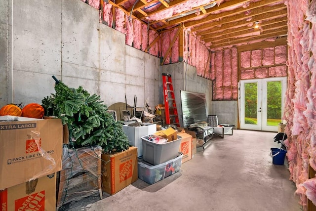 miscellaneous room featuring concrete floors and french doors