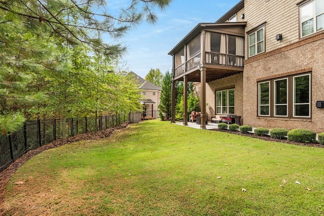 view of yard with a patio area and a sunroom