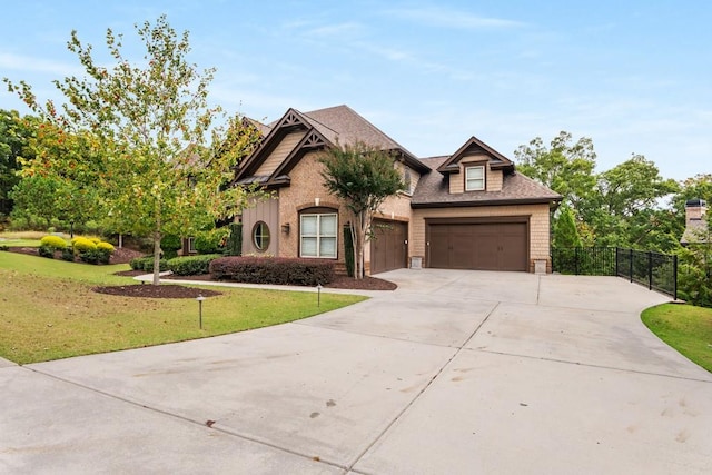 view of front of house with a front lawn and a garage