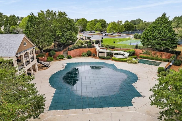 view of swimming pool with a patio