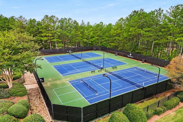 view of tennis court featuring basketball court