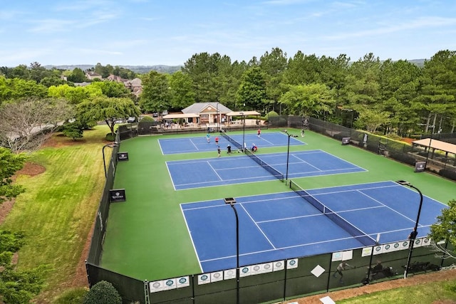 view of sport court with basketball hoop