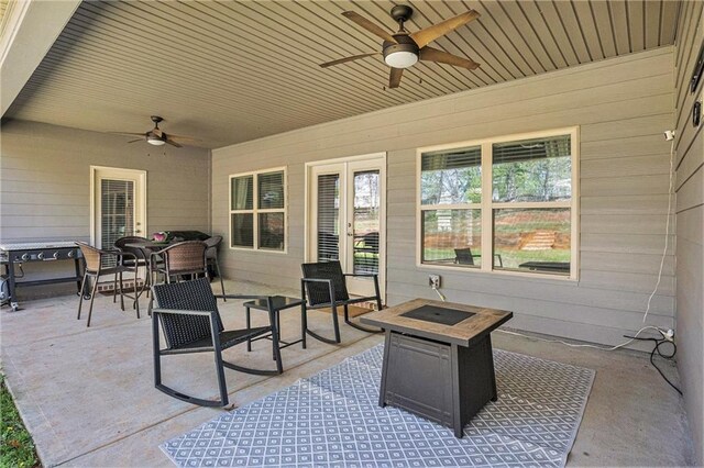 view of patio featuring outdoor dining space and a ceiling fan