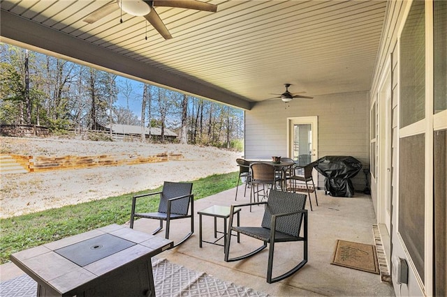 view of patio / terrace featuring ceiling fan, outdoor dining area, and area for grilling