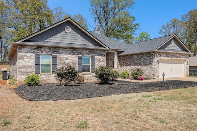single story home featuring brick siding, an attached garage, and a front lawn