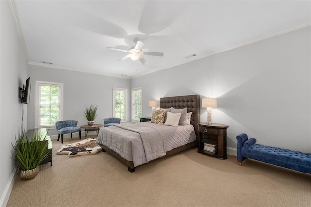 carpeted bedroom featuring ornamental molding, baseboards, and ceiling fan
