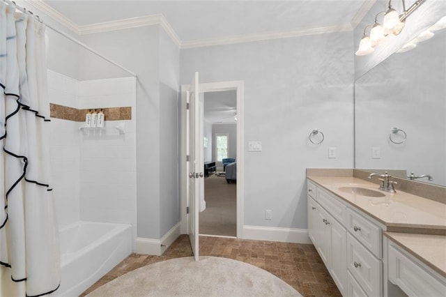bathroom with vanity, baseboards, shower / tub combo, crown molding, and connected bathroom