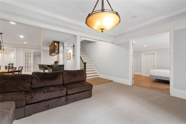 carpeted living room featuring stairway, recessed lighting, ornamental molding, and baseboards