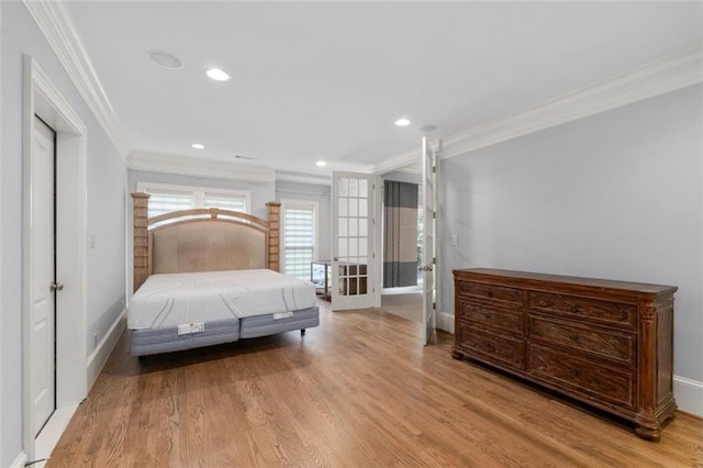 bedroom with ornamental molding, baseboards, wood finished floors, french doors, and recessed lighting