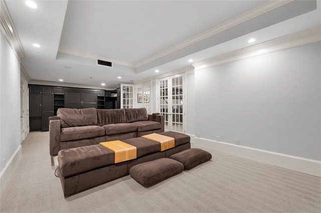 living area with crown molding, recessed lighting, light carpet, baseboards, and a raised ceiling