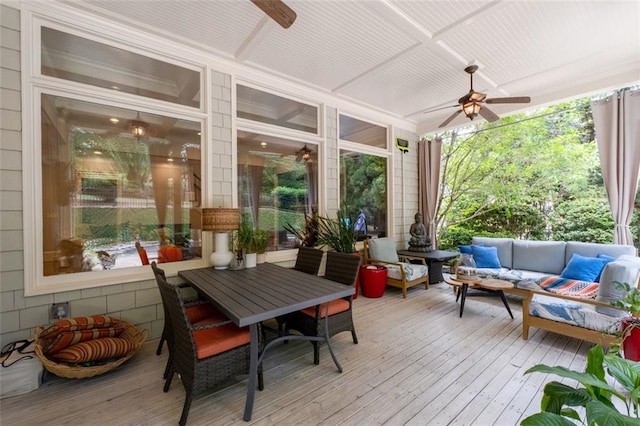 sunroom / solarium with a wooden deck and wood-type flooring