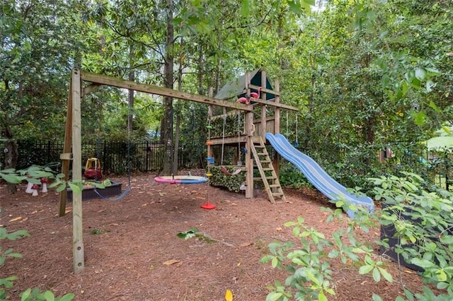 view of jungle gym featuring fence