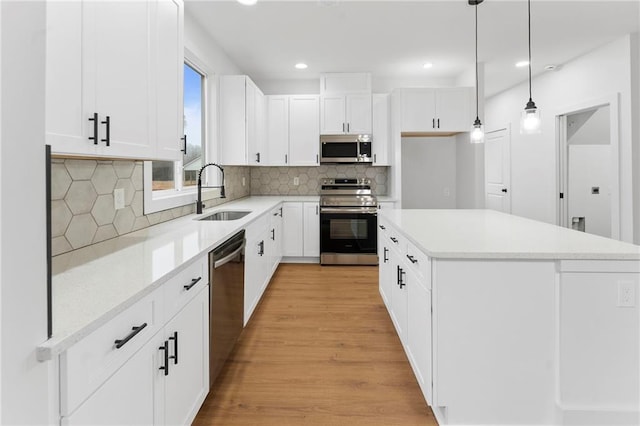 entryway featuring a wealth of natural light and light hardwood / wood-style floors