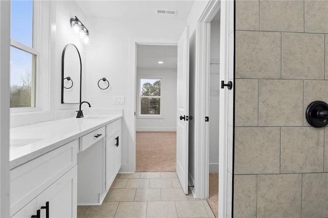 bathroom featuring tile patterned floors and vanity