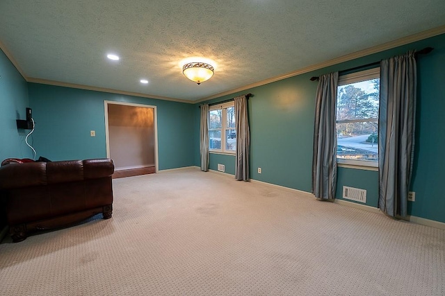 living room featuring crown molding, carpet, and a textured ceiling