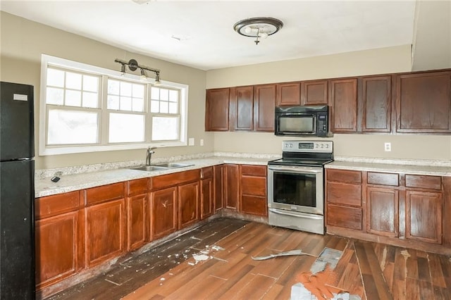 2325 E Hill Way, Norcross, GA 30071 - kitchen with black appliances, a sink, light countertops, and dark wood finished floors