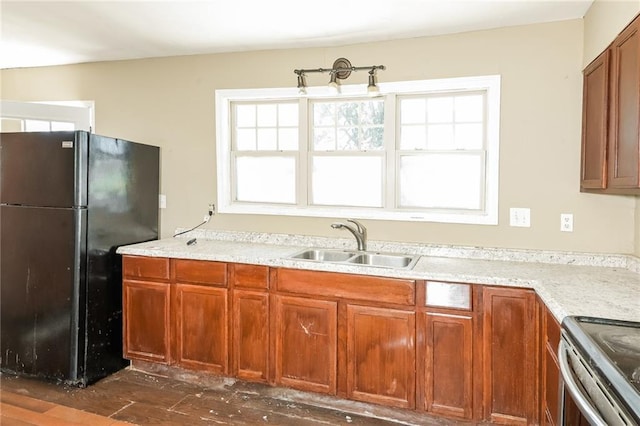 2325 E Hill Way, Norcross, GA 30071 - kitchen featuring freestanding refrigerator, a sink, dark wood-style floors, and brown cabinetry