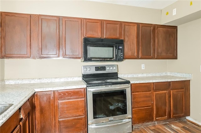 2325 E Hill Way, Norcross, GA 30071 - kitchen with black microwave, stainless steel range with electric stovetop, and light countertops