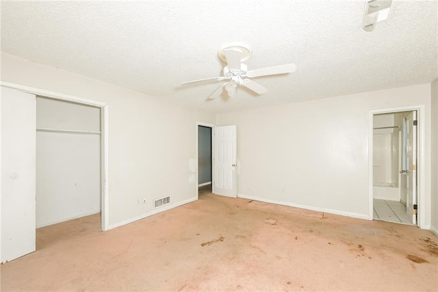 2325 E Hill Way, Norcross, GA 30071 - unfurnished bedroom with carpet, ensuite bath, baseboards, a ceiling fan, and a textured ceiling