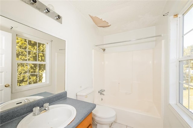 2325 E Hill Way, Norcross, GA 30071 - full bathroom featuring vanity, toilet,  shower combination, healthy amount of natural light, and a textured ceiling
