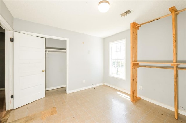 2325 E Hill Way, Norcross, GA 30071 - unfurnished bedroom featuring a closet and baseboards