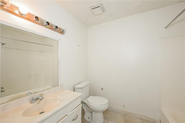 2325 E Hill Way, Norcross, GA 30071 - full bathroom with vanity, a textured ceiling, tile patterned flooring, toilet, and shower / bath combination