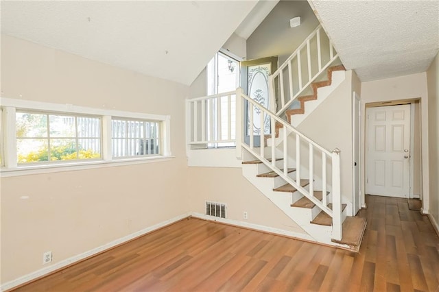 2325 E Hill Way, Norcross, GA 30071 - stairs with wood finished floors, baseboards, and a textured ceiling