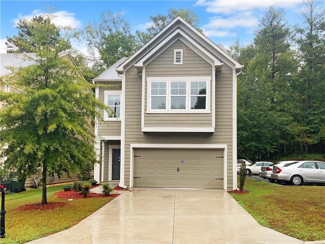 view of front facade with a front yard and a garage