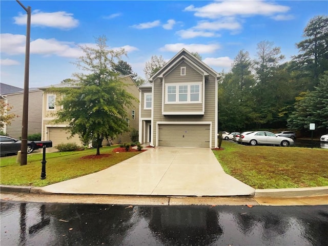 view of front of property with a front yard and a garage