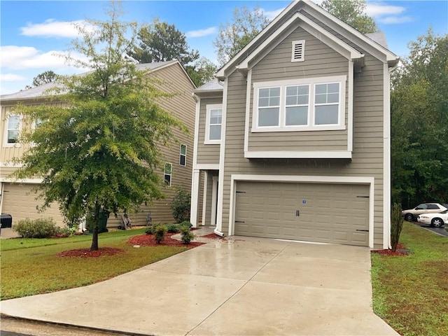 view of front of property featuring a garage and a front yard