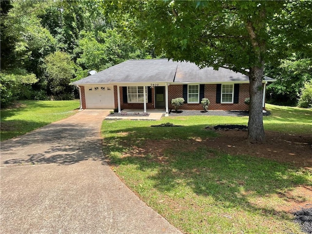 7400 Little Fawn Pkwy, Palmetto, GA 30268 - ranch-style home featuring an attached garage, driveway, brick siding, and a front lawn