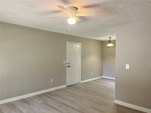 7400 Little Fawn Pkwy, Palmetto, GA 30268 - empty room with a ceiling fan, a textured ceiling, and wood finished floors
