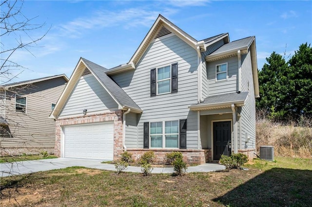 325 Nutwood Trce, Locust Grove, GA 30248 - traditional-style house featuring brick siding, driveway, central air condition unit, and an attached garage
