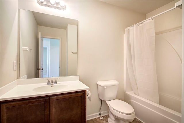 full bathroom featuring toilet, baseboards, shower / bath combination with curtain, and vanity