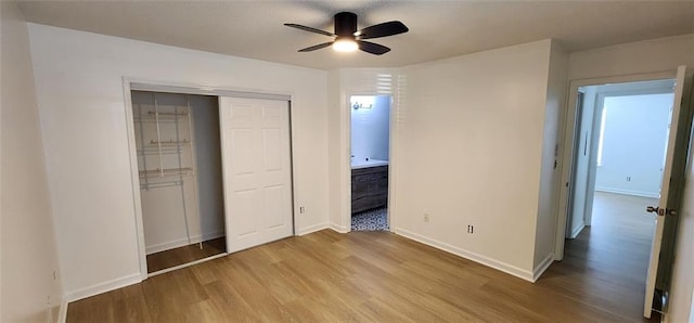 unfurnished bedroom with ceiling fan, a closet, and light hardwood / wood-style floors