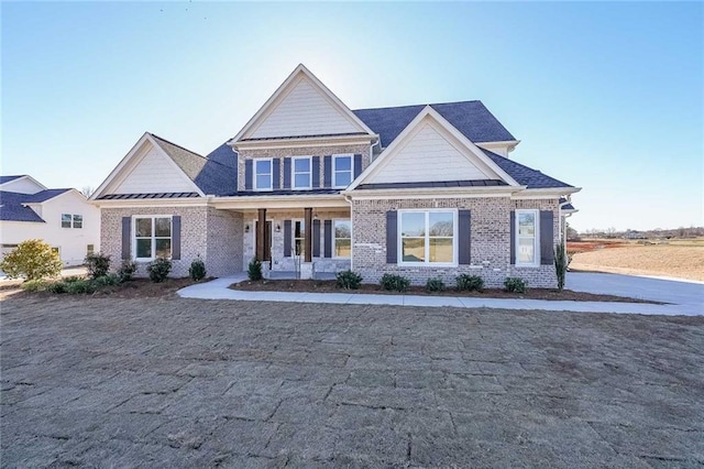 craftsman inspired home featuring covered porch